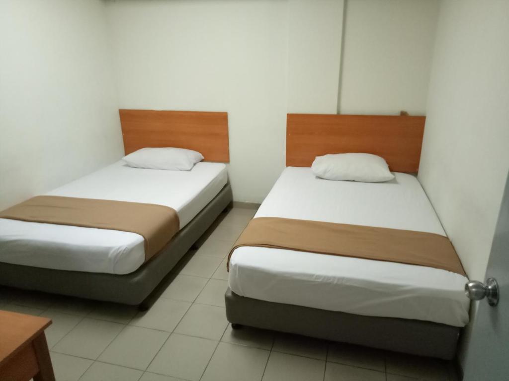 Двухместный (Двухместный номер с 2 отдельными кроватями и общей ванной комнатой), Hotel Hibiscus City (PUDU)