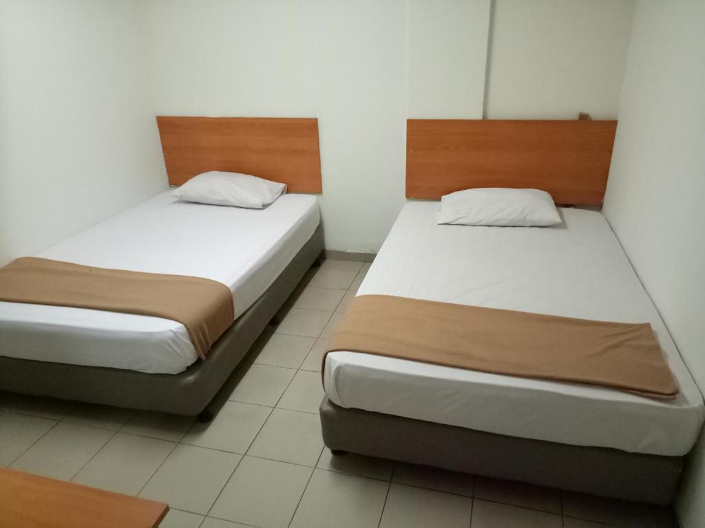 Двухместный (Двухместный номер с 2 отдельными кроватями и общей ванной комнатой), Hotel Hibiscus City (PUDU)