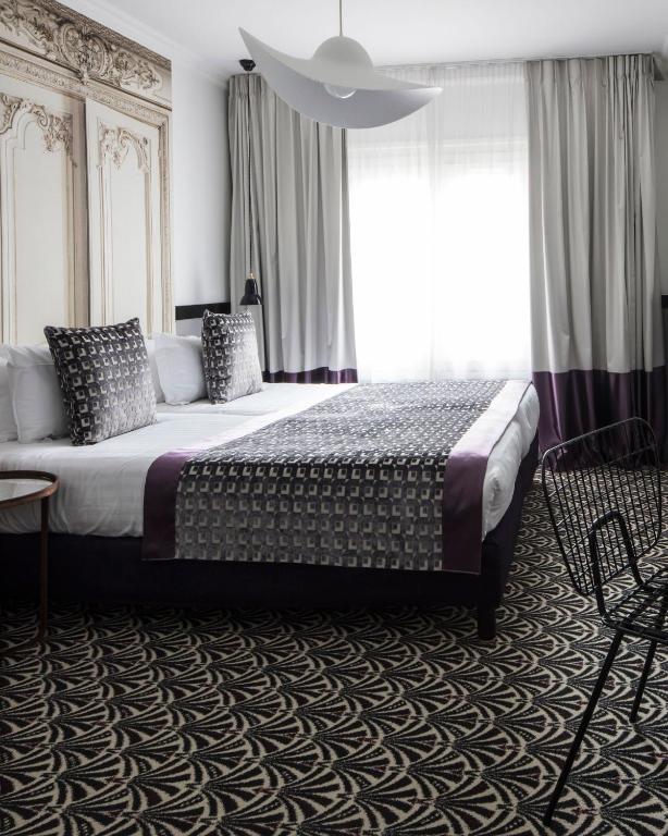 Двухместный (Улучшенный двухместный номер с 2 отдельными кроватями) отеля Hotel Malte - Astotel, Париж