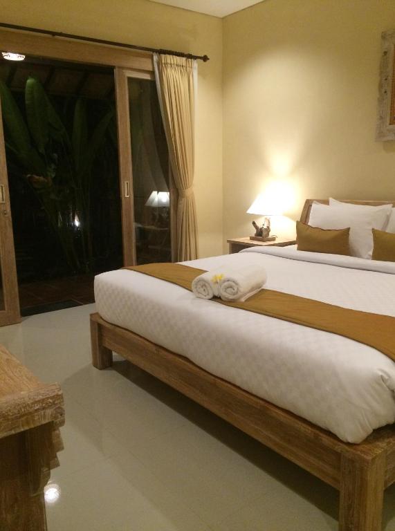 Двухместный (Двухместный номер Делюкс с 1 кроватью или 2 отдельными кроватями и видом на бассейн) семейного отеля Kailash Bali, Убуд