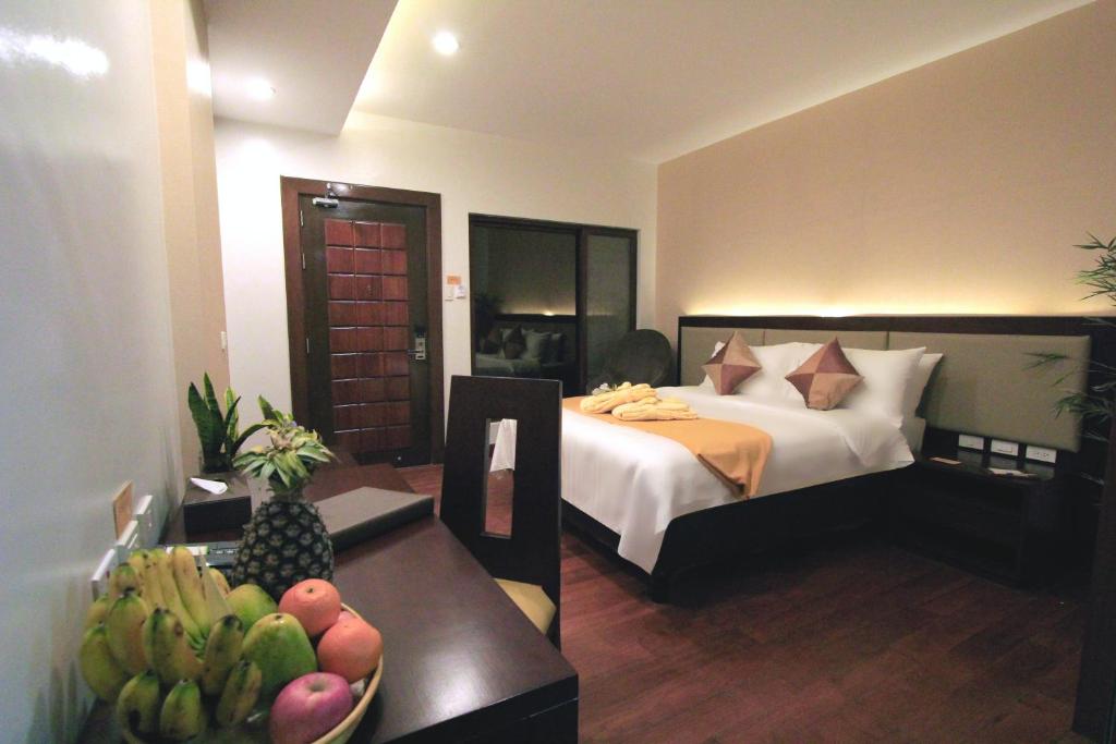 Двухместный (Улучшенный номер с 2 двуспальными кроватями) курортного отеля Coron Soleil Garden Resort, Корон