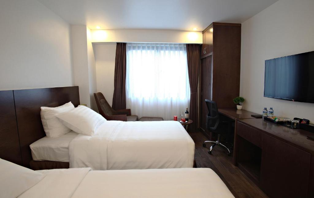 Двухместный (Двухместный номер Делюкс с 1 кроватью или 2 отдельными кроватями) отеля Poonsa Hanoi Hotel, Ханой
