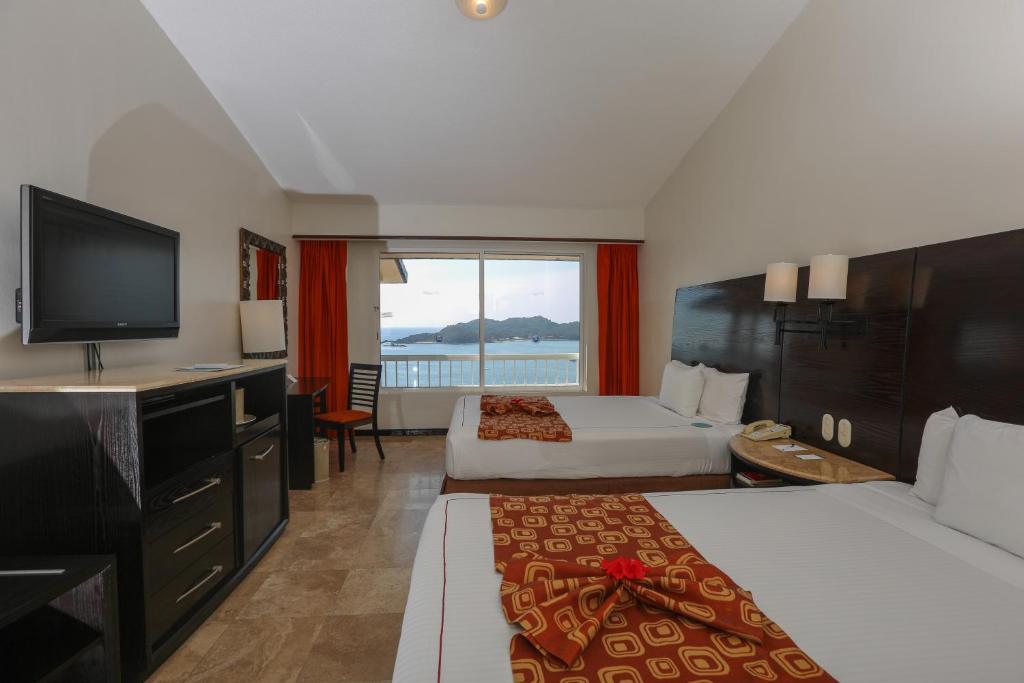Двухместный (Номер Делюкс с видом на океан (для 2 взрослых)) курортного отеля Azul Ixtapa Resort - Все включено, Икстапа