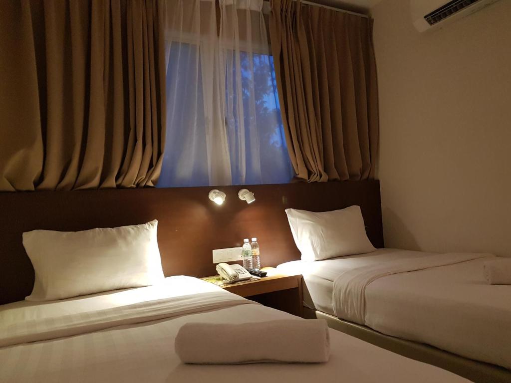 Двухместный (Двухместный номер Делюкс с 2 отдельными кроватями) отеля Hotel Asia, Лангкави