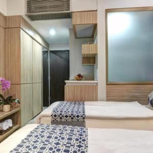 Двухместный (Улучшенный двухместный номер с 2 отдельными кроватями) отеля Sampit Residence Managed by FLAT06, Джакарта