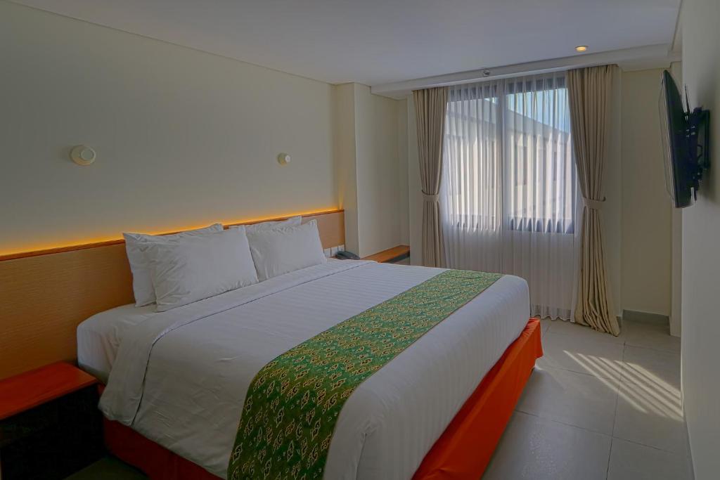 Двухместный (Улучшенный двухместный номер с 1 кроватью или 2 отдельными кроватями) курортного отеля Hotel Dafam Savvoya Seminyak, Семиньяк