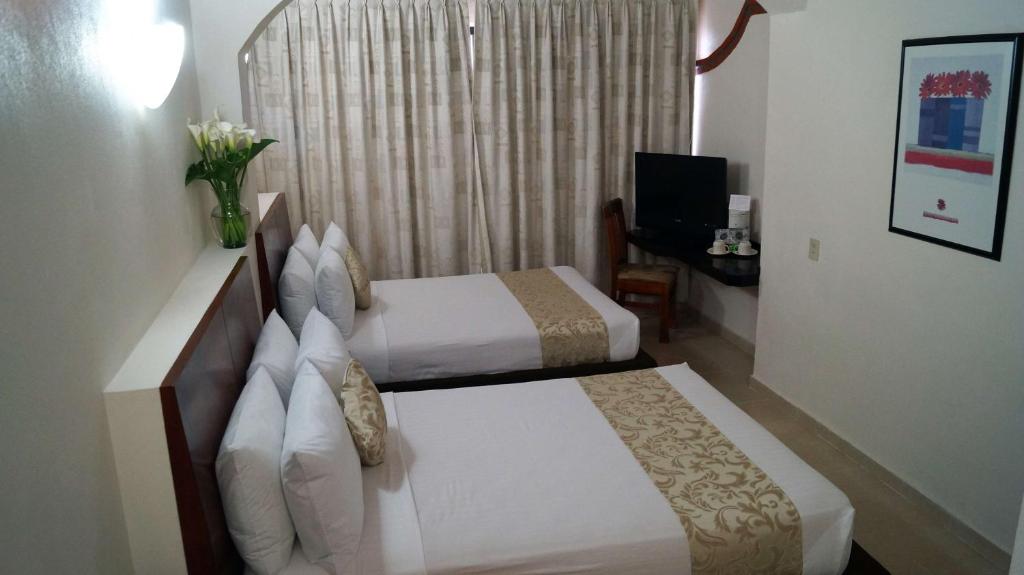 Сьюит (Двухместный люкс с 2 двуспальными кроватями - Для некурящих) отеля Best Western Taxco, Таско-де-Аларкон
