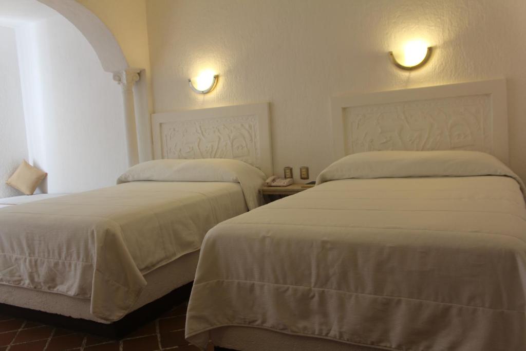 Двухместный (Двухместный номер с 2 двуспальными кроватями) отеля Hotel Aldea del Bazar & Spa, Пуэрто-Эскондидо