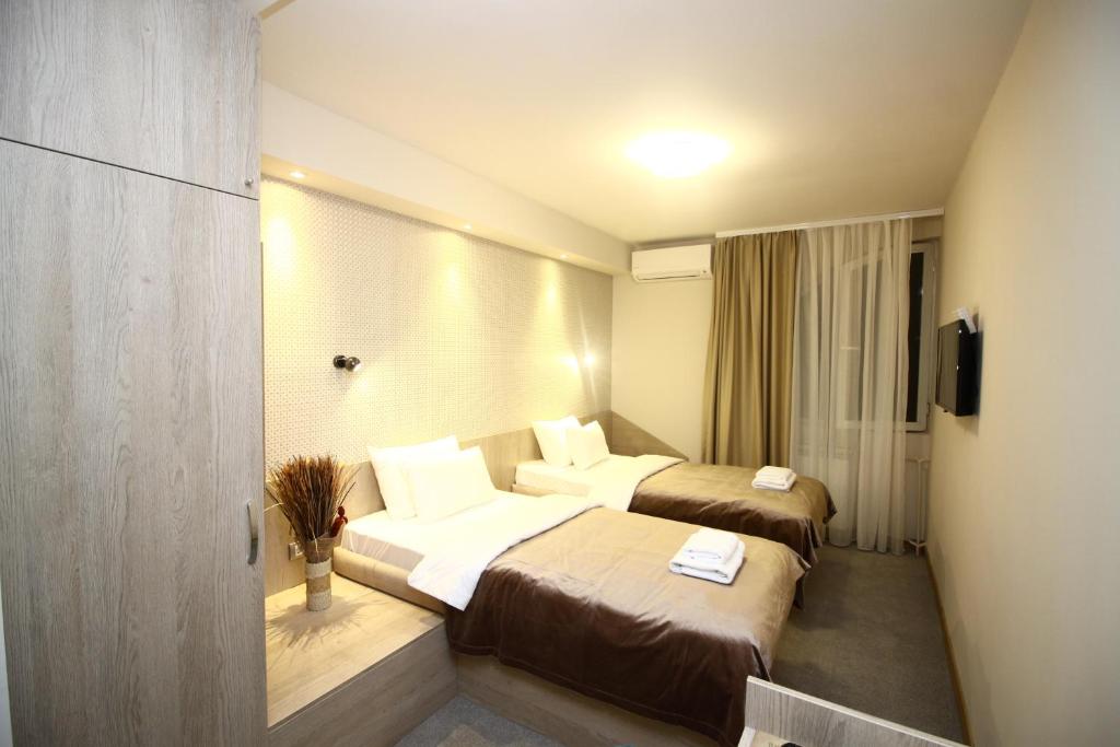 Двухместный (Стандартный двухместный номер с 2 отдельными кроватями) отеля Garni Hotel Mlinarev san, Ариле