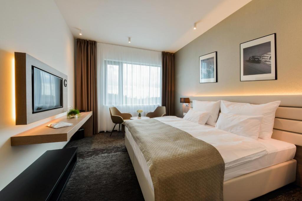 Двухместный (Улучшенный двухместный номер с 1 кроватью или 2 отдельными кроватями и террасой для гостей мотогонок MotoGP) отеля Grid Hotel, Брно