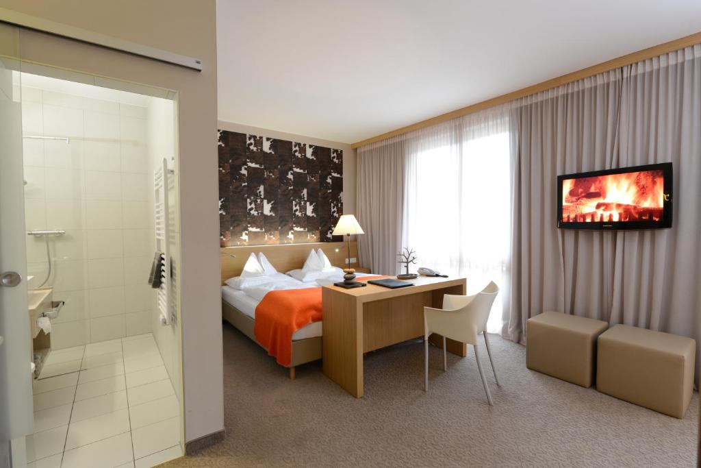 Двухместный (Эксклюзивный двухместный номер с 1 кроватью (для 2 взрослых и 2 детей)) отеля Hotel Moserhof, Милльштатт-ам-Зе