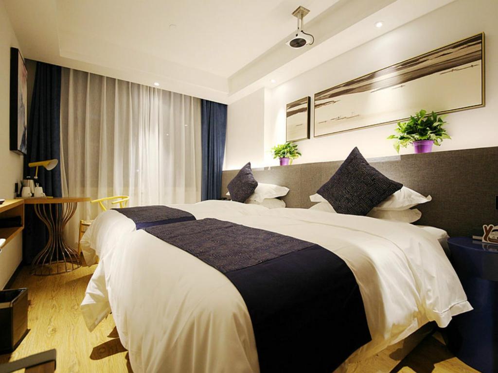 Двухместный (Двухместный номер бизнес-класса с 2 отдельными кроватями) отеля Lanmei Boutique Hotel Xiyuan Branch Lanzhou, Ланьчжоу