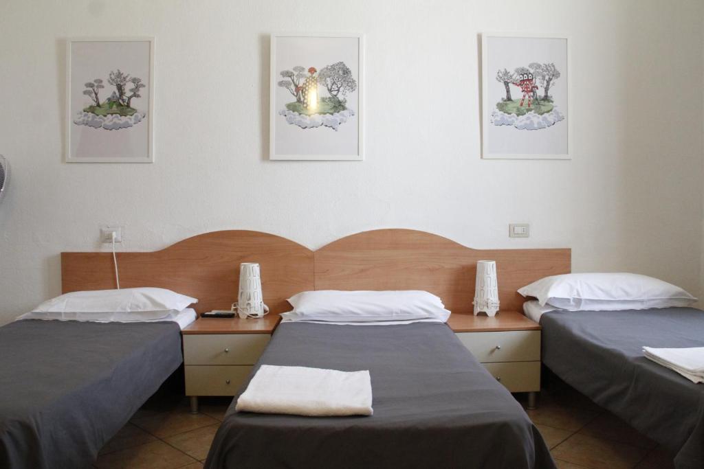 Четырехместный (Четырехместный номер с общей ванной комнатой) отеля Hotel Alba, Милан