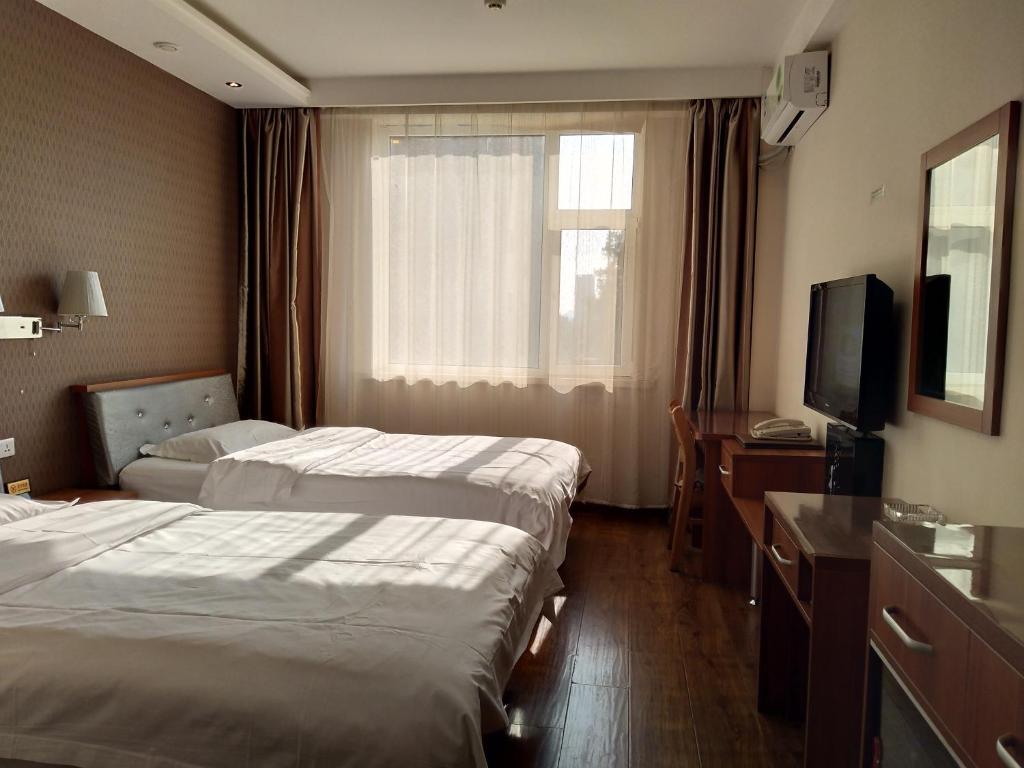 Двухместный (Двухместный номер с 2 отдельными кроватями) отеля Changchun Yuqiao Hotel Huizhan Branch, Чанчунь