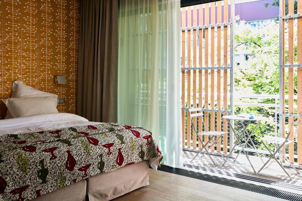 Двухместный (Двухместный номер Делюкс с 1 кроватью или 2 отдельными кроватями и балконом) отеля Eden Lodge Paris, Париж