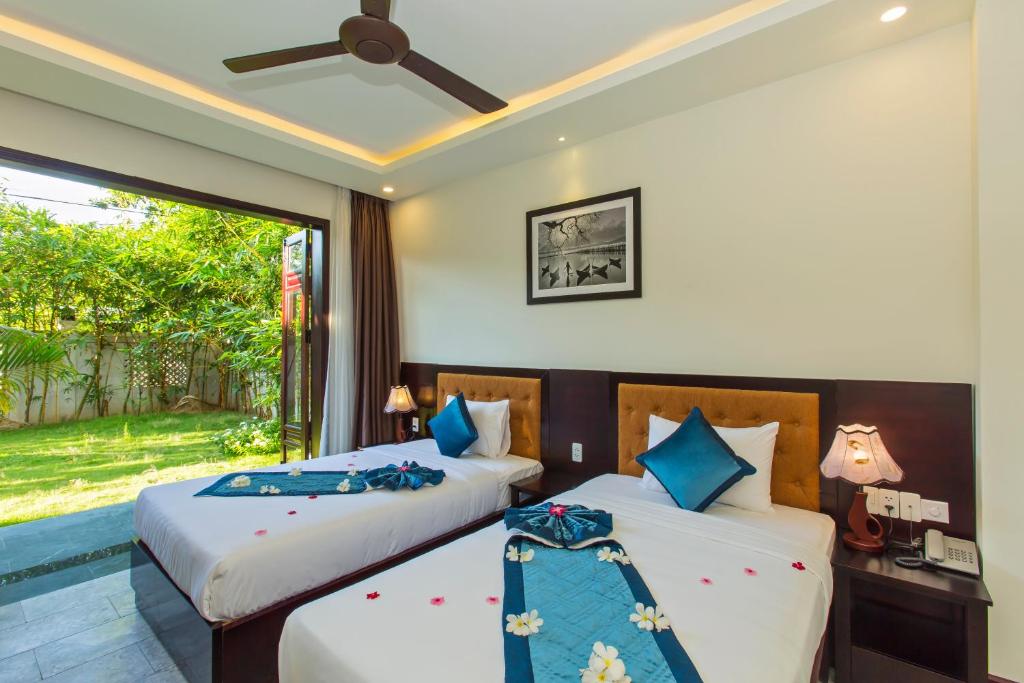 Двухместный (Улучшенный двухместный номер с 1 кроватью или 2 отдельными кроватями и видом на сад) отеля Pearl River Hoi An Hotel, Хойан