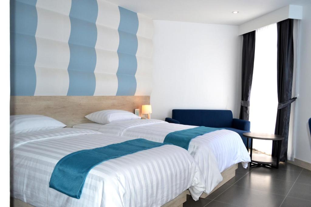 Двухместный (Улучшенный двухместный номер с 1 кроватью или 2 отдельными кроватями, вид на город) отеля Flipper Lodge, Паттайя