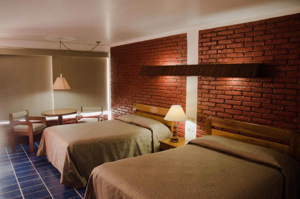 Четырехместный (Четырехместный номер с ванной комнатой) отеля Hotel Plaza Palmas, Туспам-де-Родригес-Кано
