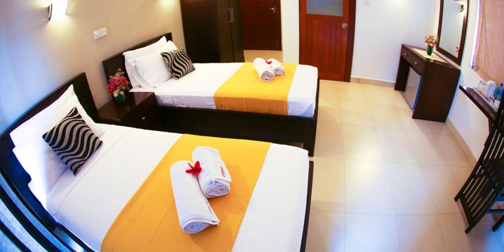 Двухместный (Двухместный номер Делюкс с 2 отдельными кроватями) отеля Hotel Shanelo, Негомбо