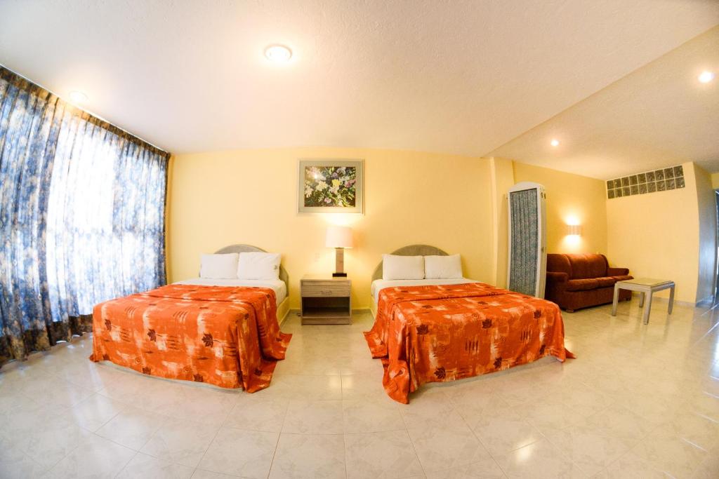 Двухместный (Двухместный номер с 2 двуспальными кроватями) отеля Hotel & Spa Villa Vergel, Икстапан де Ла Саль