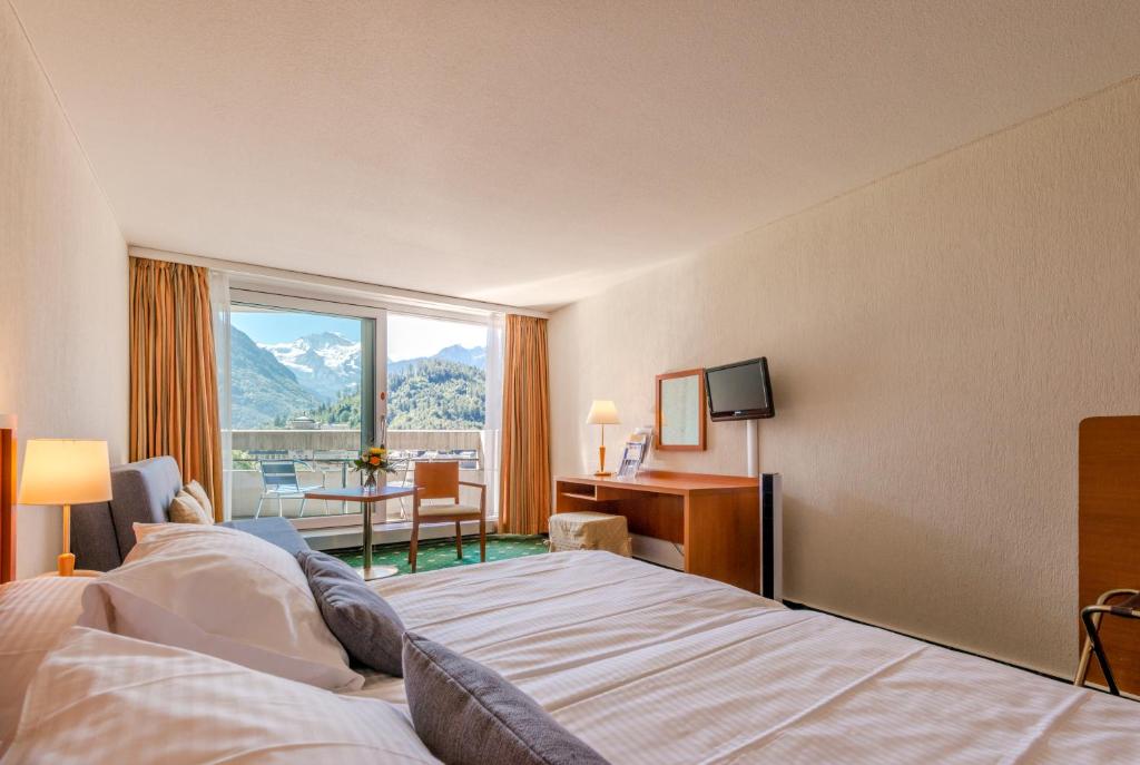 Двухместный (Стандартный двухместный номер с 1 кроватью или 2 отдельными кроватями) отеля Metropole Swiss Quality Hotel, Интерлакен