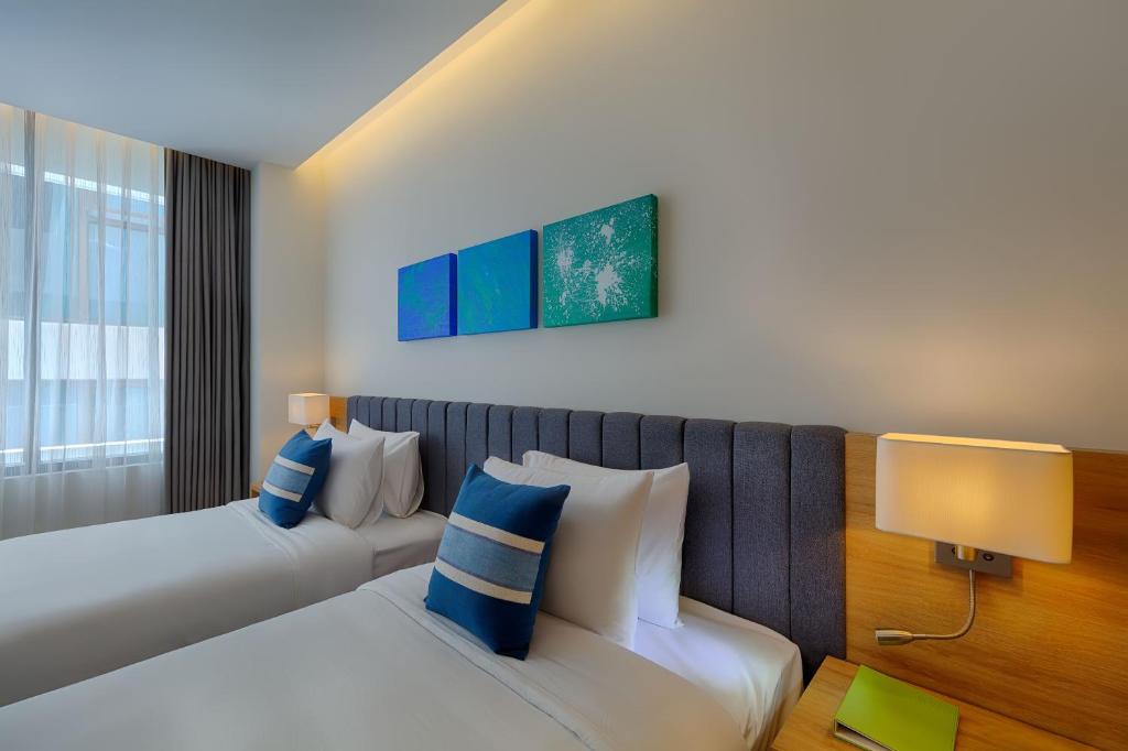 Двухместный (Двухместный номер Делюкс с 1 кроватью или 2 отдельными кроватями и частичным видом на море) отеля Belle Maison Parosand Danang, Дананг