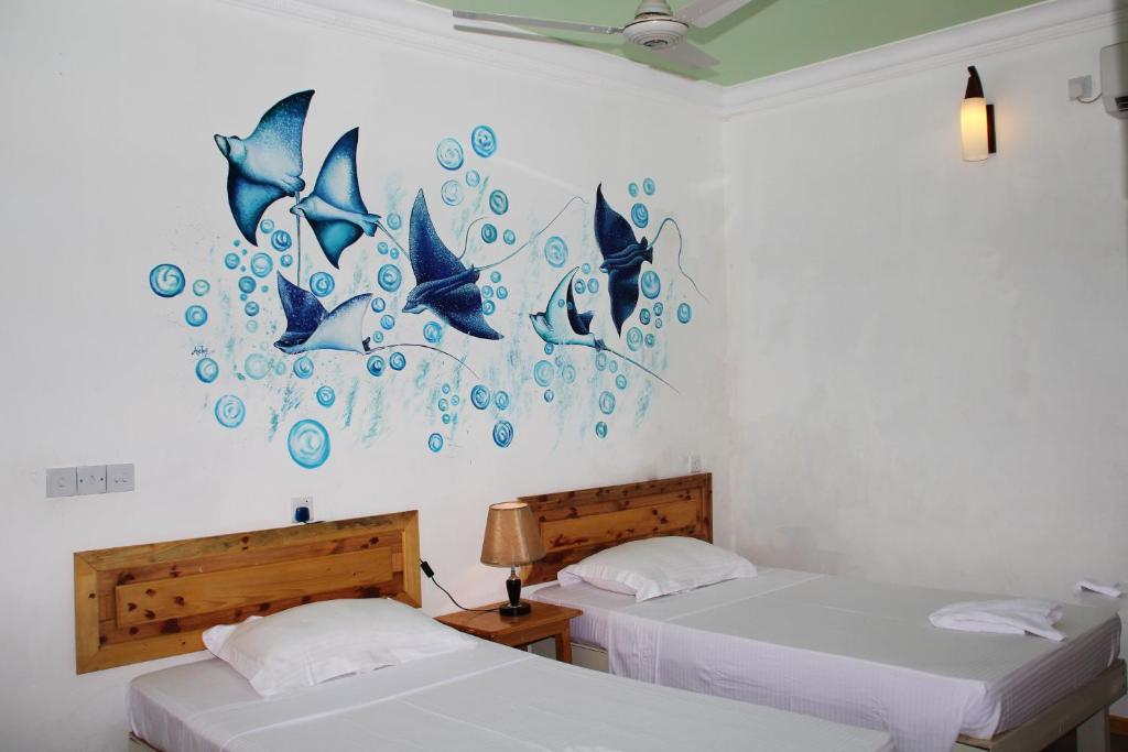 Двухместный (Стандартный двухместный номер с 2 отдельными кроватями) гостевого дома Kaafu Inn Guraidhoo, Гурайдо