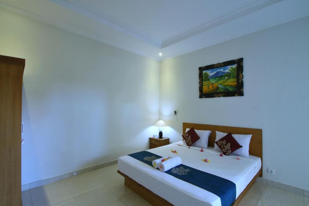 Двухместный (Двухместный номер Делюкс с 1 кроватью и балконом) семейного отеля Kubu Taman Home Stay, Убуд
