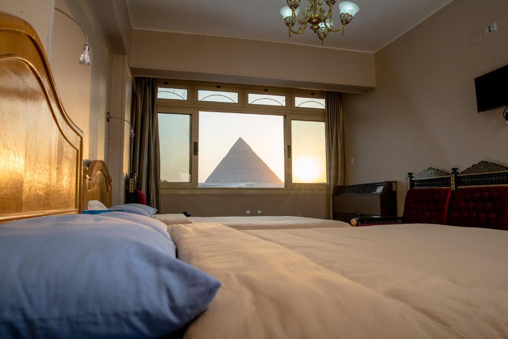 Двухместный (Двухместный номер с 1 кроватью или 2 отдельными кроватями и видом на пирамиды) хостела Guardian Guest House, Каир