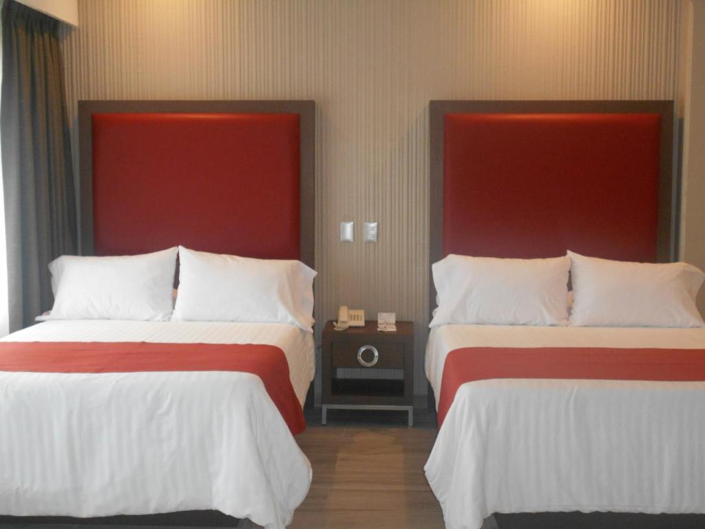 Двухместный (Двухместный номер с 2 двуспальными кроватями) отеля Hotel Puente Real, Пуэбла