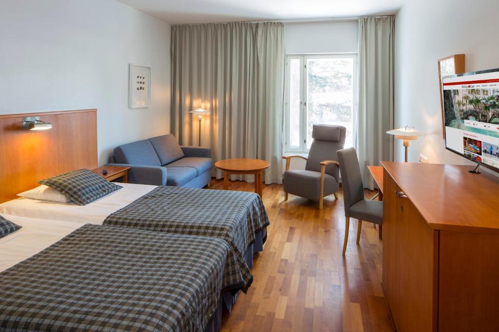 Двухместный (Стандартный двухместный номер с 2 отдельными кроватями - Без доступа в спа-салон) отеля Holiday Club Kuusamon Tropiikki, Куусамо