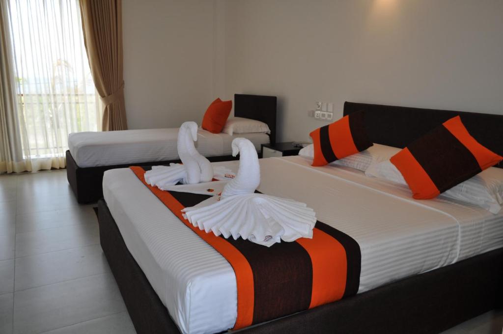 Трехместный (Трехместный номер Делюкс с видом на море) отеля Amanda Beach Resort, Калкудах