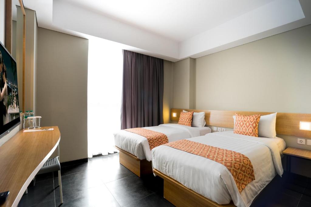 Двухместный (Двухместный номер Делюкс с 1 кроватью или 2 отдельными кроватями) отеля Maple Hotel Grogol, Джакарта