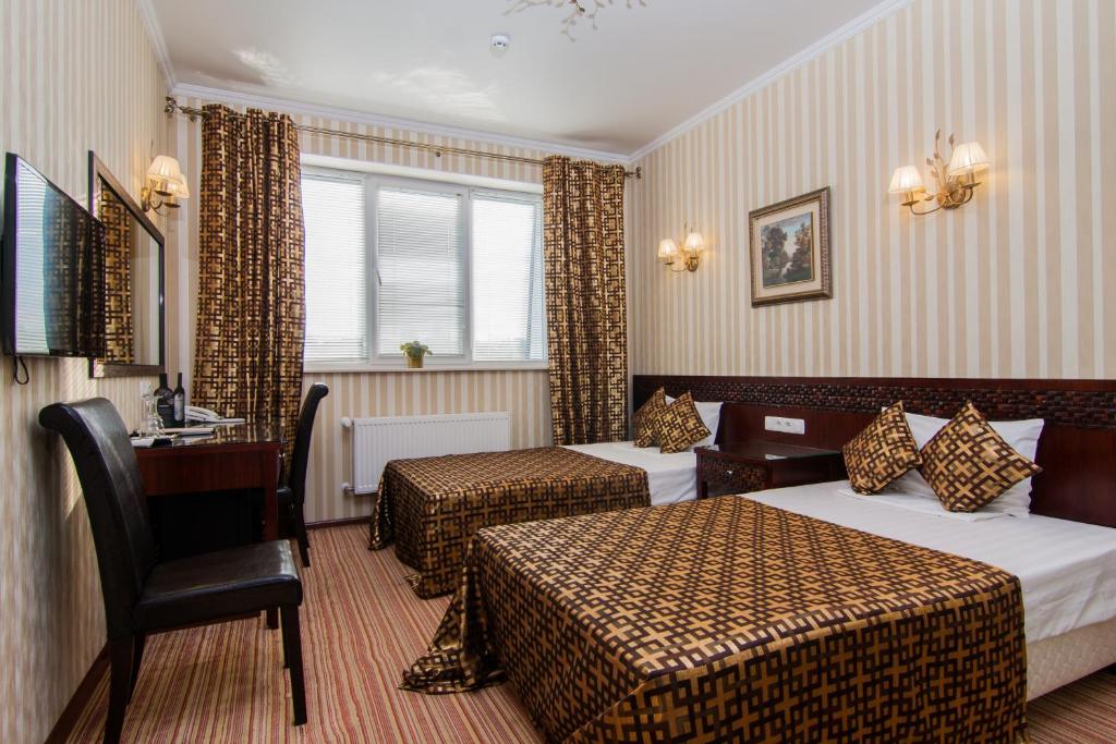 Двухместный (Улучшенный двухместный номер с 2 отдельными кроватями) отеля Классик, Кишинев