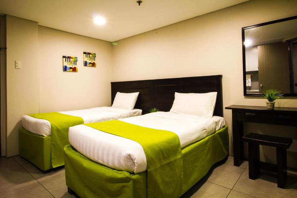 Двухместный (Двухместный номер Делюкс с 2 отдельными кроватями) отеля Jade Hotel and Suites, Манила