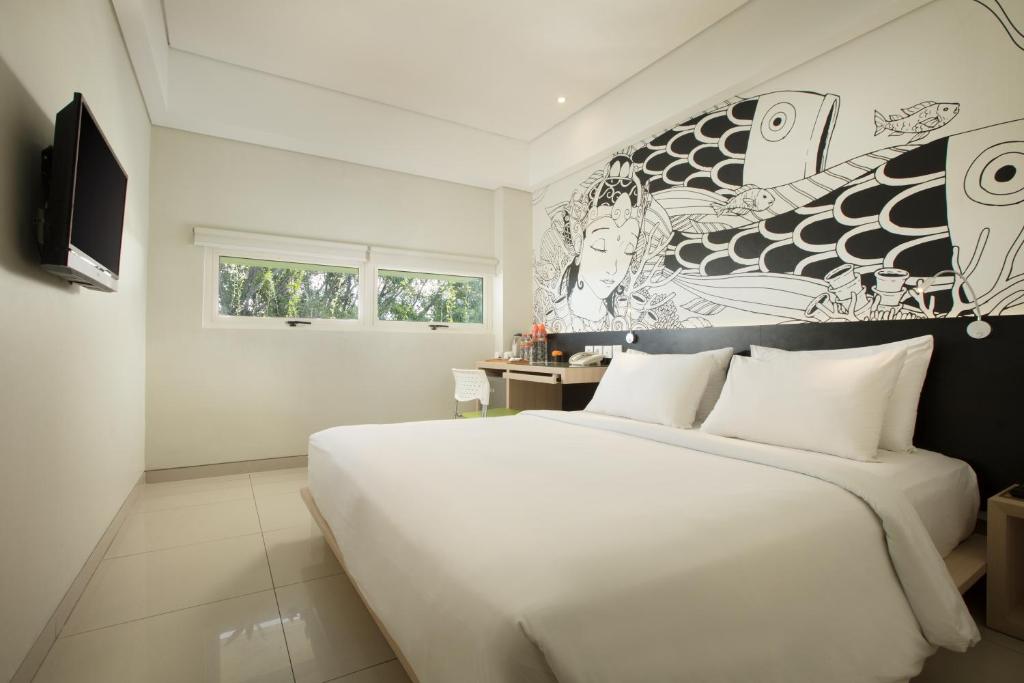 Двухместный (Уютный двухместный номер с 1 кроватью или 2 отдельными кроватями) отеля Grandmas Plus Hotel Airport, Кута