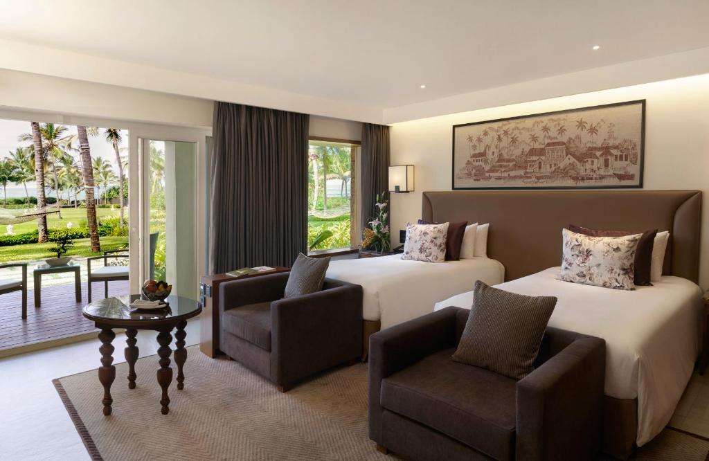 Двухместный (Номер Делюкс с видом на море и 2 отдельными кроватями) курортного отеля Taj Exotica Resort & Spa, Goa, Бенаулим