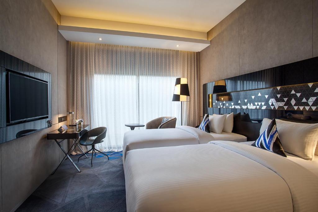 Двухместный (Двухместный номер Делюкс с 2 отдельными кроватями) отеля Novotel Singapore On Stevens, Сингапур (город)