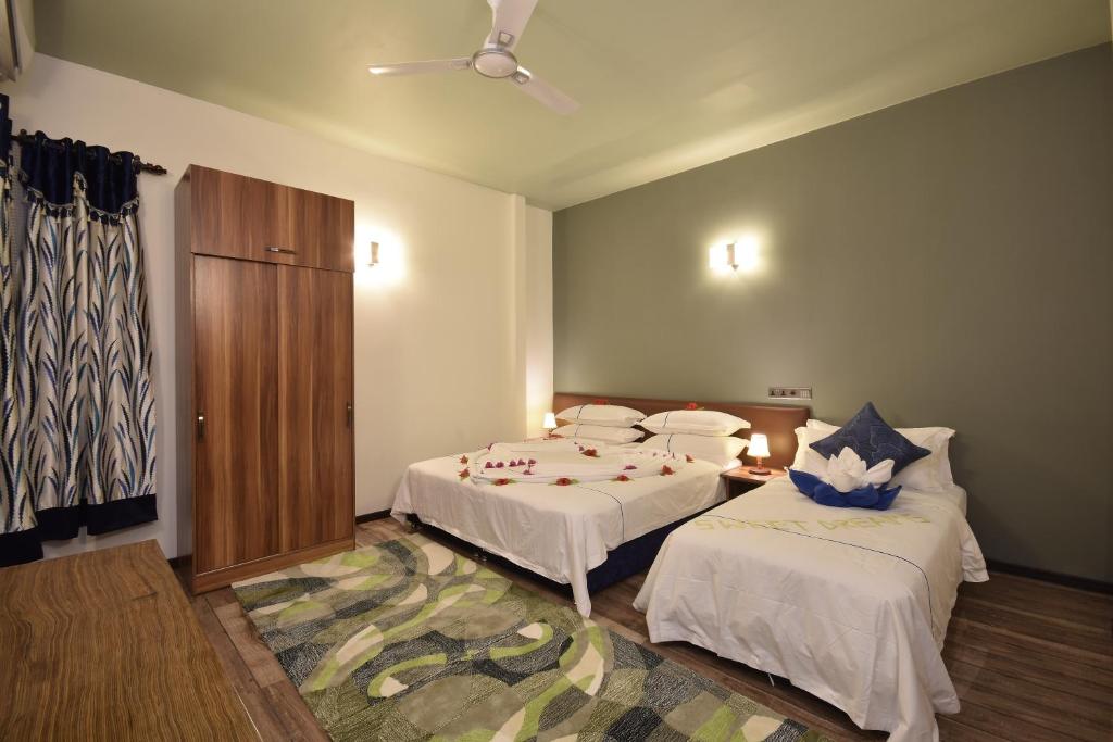 Двухместный (Улучшенный двухместный номер с 1 кроватью или 2 отдельными кроватями) гостевого дома Island Home Ukulhas, Укулхас