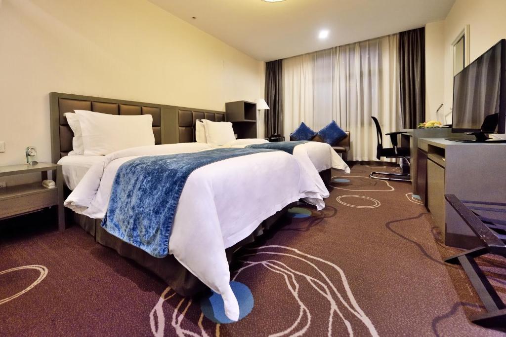 Двухместный (Двухместный номер Делюкс с 2 отдельными кроватями) отеля Metropolo Classiq, Shanghai, YMCA-People square, Шанхай
