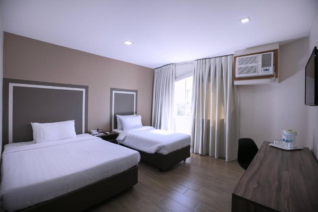 Трехместный (Роскошный трехместный номер) отеля S Hotel & Residences, Себу