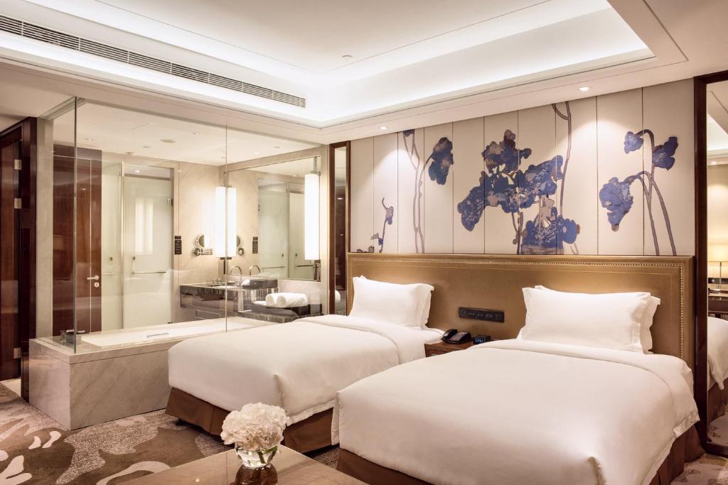 Двухместный (Улучшенный двухместный номер с 2 отдельными кроватями и 1 завтраком) отеля Minyoun Chengdu Dongda Hotel, Чэнду
