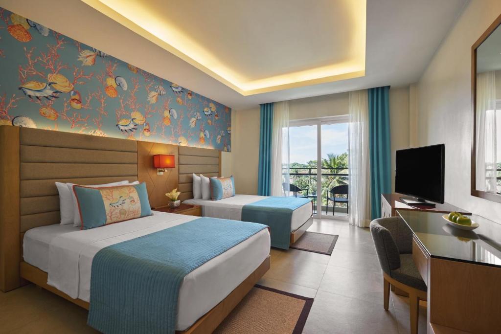 Двухместный (Улучшенный номер с 2 отдельными кроватями, вид на море) курортного отеля Movenpick Resort & Spa Boracay, Боракай