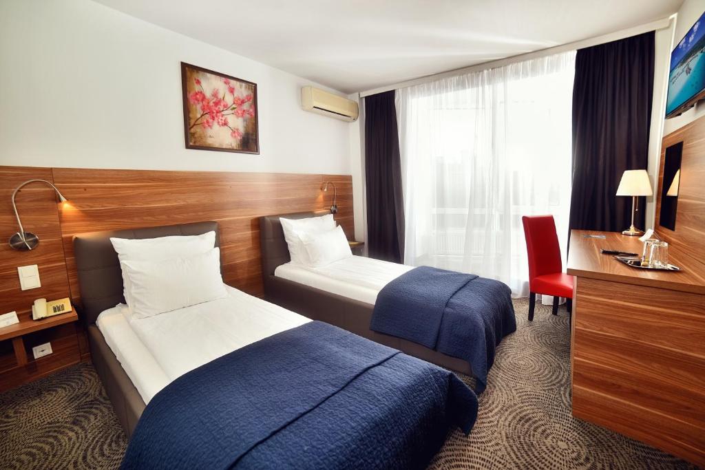 Двухместный (Двухместный номер с 2 отдельными кроватями) отеля Hotel President, Тимишоара