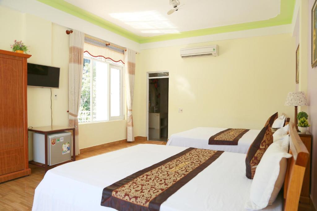 Двухместный (Большой двухместный номер с 2 отдельными кроватями) отеля Phong Nha Midtown Hotel, Донгхой