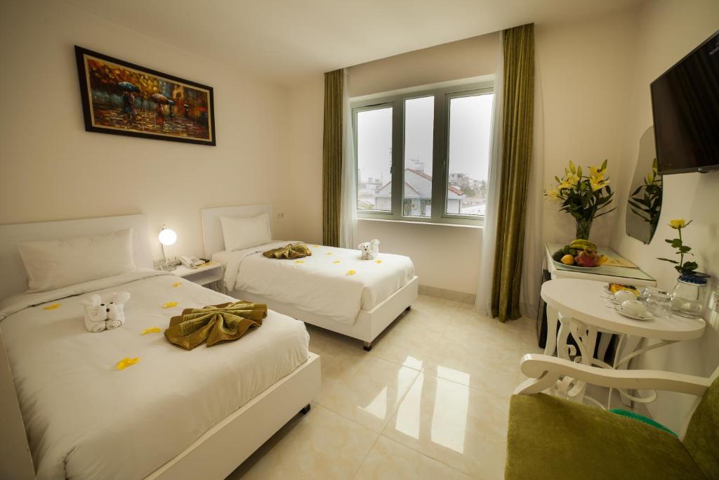 Двухместный (Двухместный номер Делюкс с 1 кроватью или 2 отдельными кроватями) отеля Hotel La Perle, Хюэ