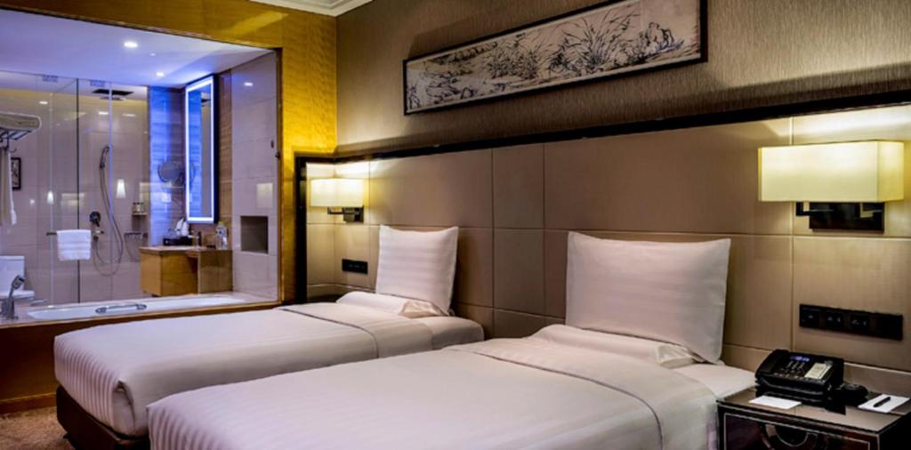 Двухместный (Двухместный номер Делюкс с 2 отдельными кроватями) отеля Pullman Qingdao Ziyue, Циндао
