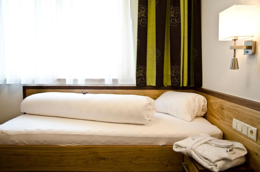 Одноместный (Одноместный номер Делюкс с балконом) отеля Hotel Garni Arosa, Ишгль
