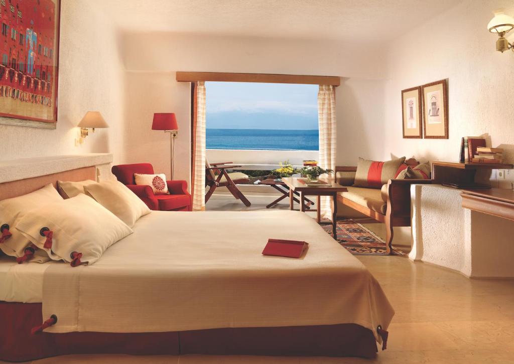 Двухместный (Двухместный номер с 2 отдельными кроватями и видом на море) курортного отеля Elounda Mare Relais & Châteaux Hotel, Элунда