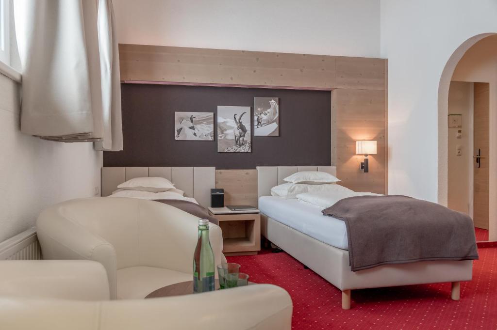 Двухместный (Стандартный двухместный номер с 2 отдельными кроватями) отеля Alpenhotel Enzian, Зёльден